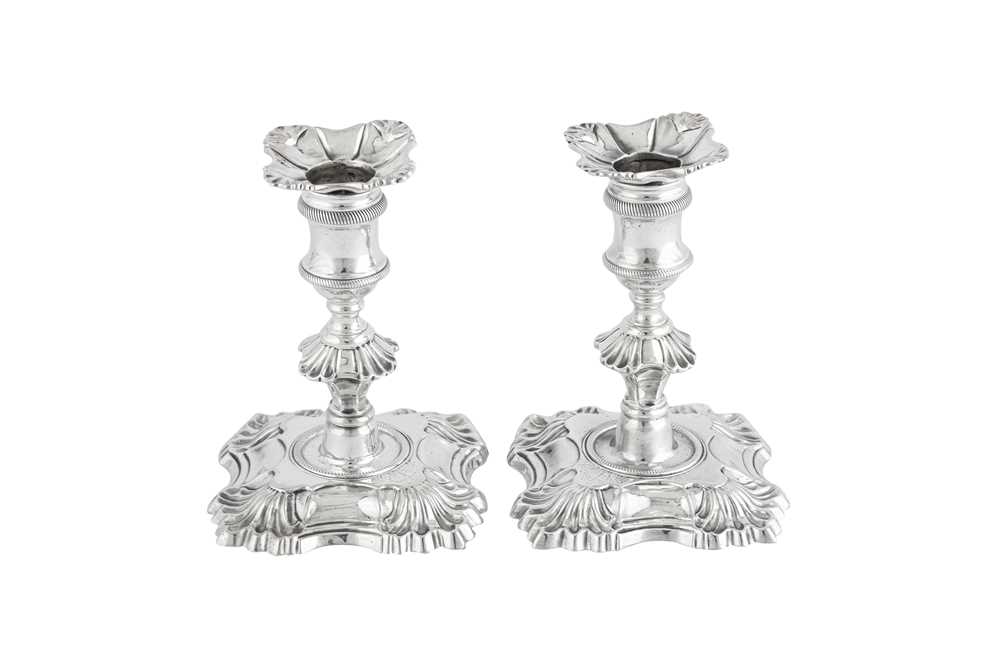 Lot 673 - A pair of George II sterling silver dwarf or library desk candlesticks, London 1756 by John Perry (first reg. 23rd March 1757)