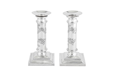Lot 223 - A pair of early 20th century Chinese Export silver dwarf or desk candlesticks, Canton circa 1910 retailed by Wang Hing