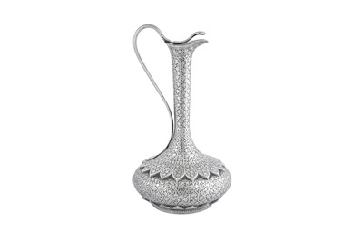 Lot 104 - A late 19th century Anglo – Indian unmarked silver claret jug or ewer, Kashmir circa 1890