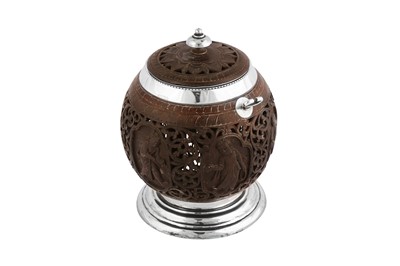 Lot 97 - An early 20th century Indian Colonial silver mounted Burmese coconut honey pot, Madras circa 1910 by Peter Orr and Sons