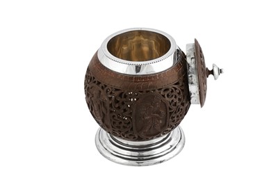Lot 97 - An early 20th century Indian Colonial silver mounted Burmese coconut honey pot, Madras circa 1910 by Peter Orr and Sons