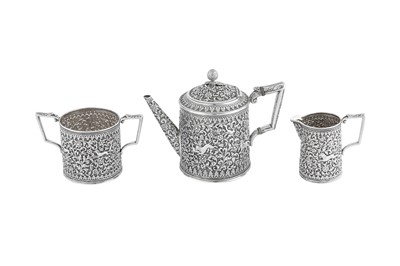 Lot 141 - A rare documentary late 19th century Anglo – Indian silver three-piece tea service, Cutch, Bhuj circa 1880 by Oomersi Mawji (active 1860-90)