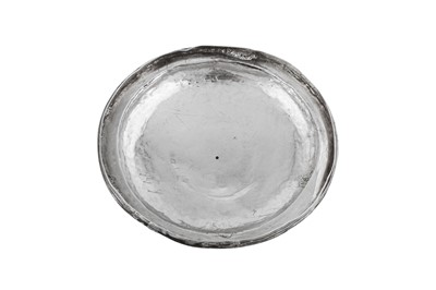 Lot 692 - An Elizabeth I sterling silver communion cup cover (paten), London 1569, makers mark a millrind in a shaped cartouche (unidentified)