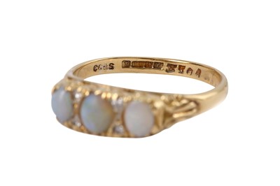 Lot 23 - A three-stone opal ring