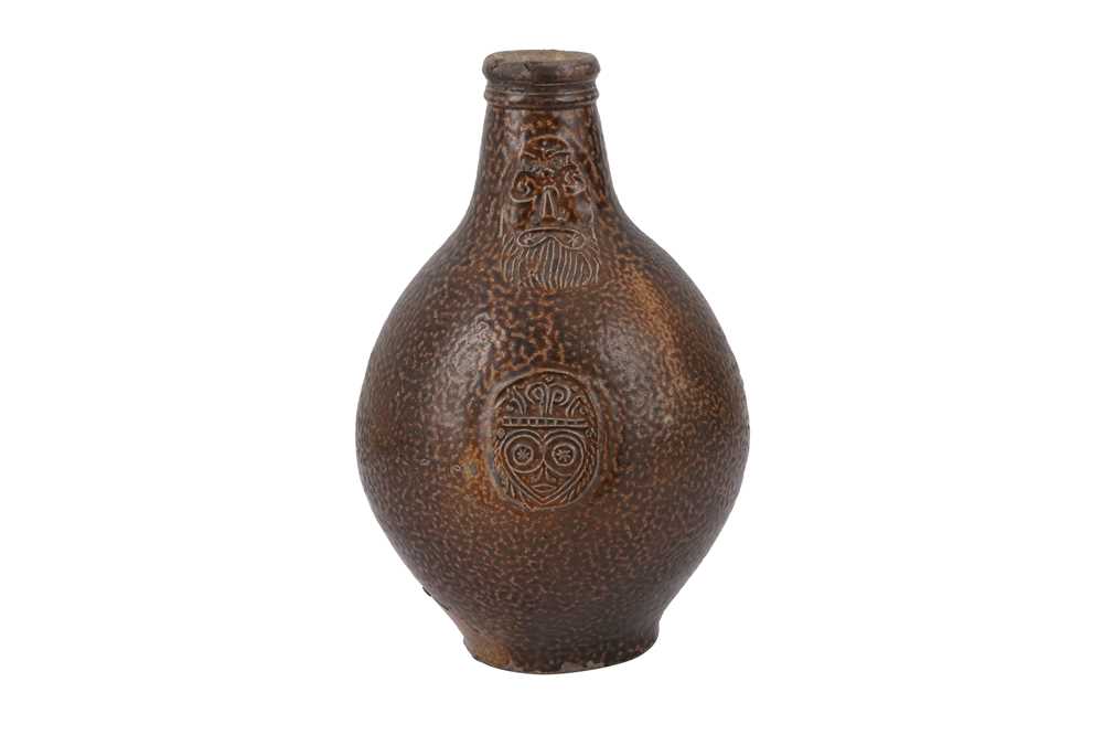 Lot 124 - A 17TH CENTURY SALT GLAZED STONEWARE BELLARMINE JUG