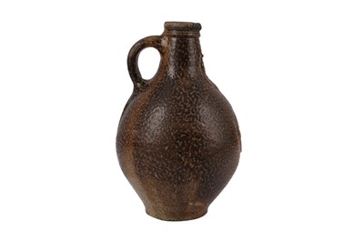 Lot 124 - A 17TH CENTURY SALT GLAZED STONEWARE BELLARMINE JUG