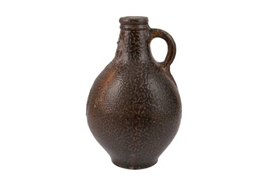 Lot 124 - A 17TH CENTURY SALT GLAZED STONEWARE BELLARMINE JUG