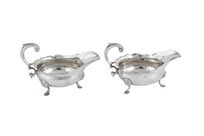 Lot 682 - A pair of George II sterling silver sauce boats, London 1751 by John Harvey I (this mark reg. 16th August 1750)