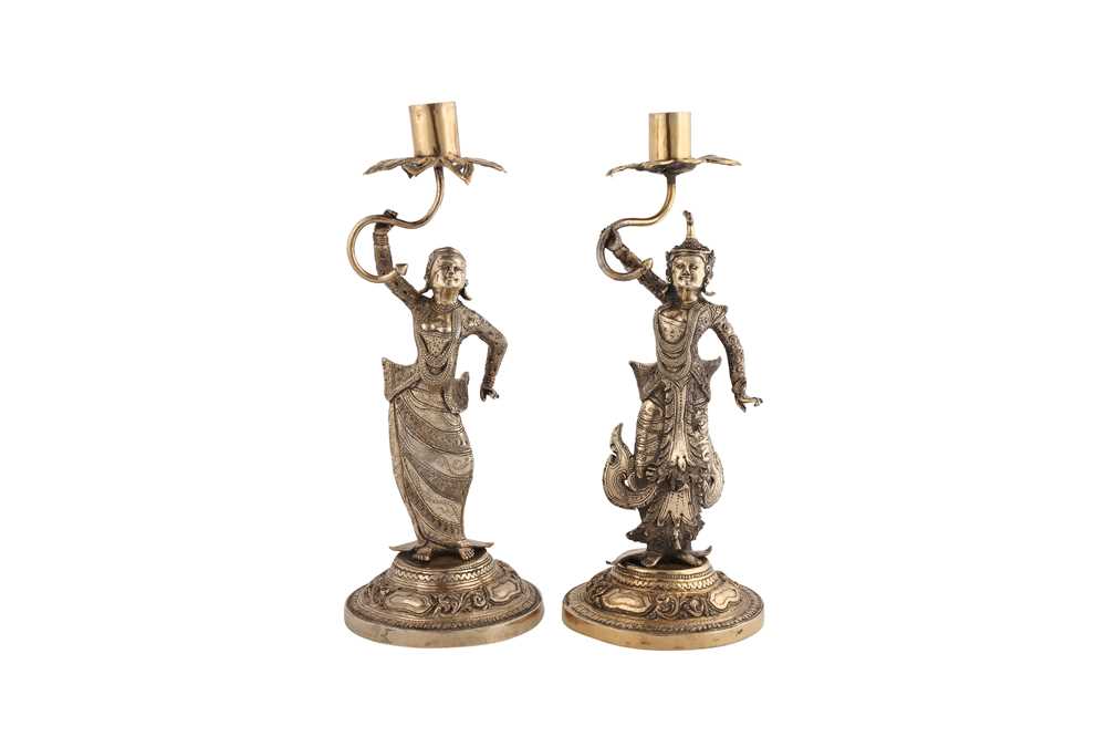 Lot 176 - A pair of heavy late 19th century Burmese silver gilt candlesticks, Thayetmyo circa 1880-1900