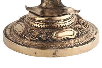 Lot 176 - A pair of heavy late 19th century Burmese silver gilt candlesticks, Thayetmyo circa 1880-1900