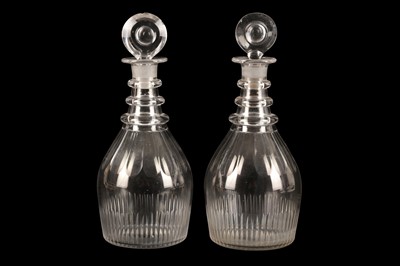 Lot 74 - A NEAR PAIR OF GEORGE III GLASS DECANTERS, EARLY 19TH CENTURY