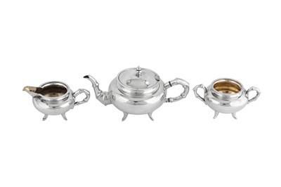Lot 228 - An early 20th century Chinese Export silver three-piece tea service, Canton circa 1910 retailed by Wang Hing
