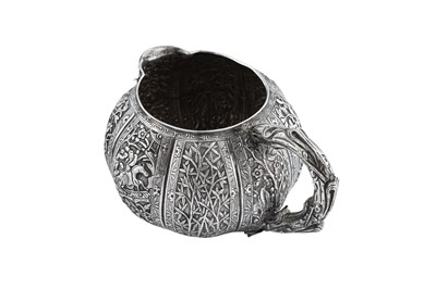 Lot 204 - A late 19th century Chinese Export unmarked silver milk jug, Jiujiang circa 1880 attributed to Tu Qing Yun