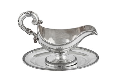 Lot 294 - A mid- 19th century French 950 standard silver sauceboat on stand, the sauceboat Paris circa 1850 by Louis Manaut (reg. 7th Jan 1829)