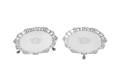 Lot 657 - A pair of George II sterling silver waiters, London 1749 by John Robinson II (this mark reg. 3th July 1739)