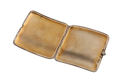 Lot 50 - An early 20th century American gold overlay silver cigarette case, circa 1920