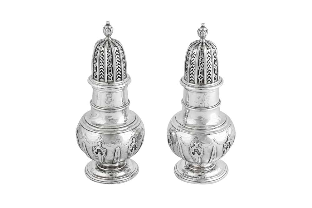 Lot 694 - A fine pair of George II sterling silver sugar casters, London 1731 by John White (first reg. 10th Dec 1719)