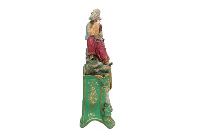 Lot 691 - AN ORIENTALIST PORCELAIN MANTEL CLOCK WITH A RESTING TURK