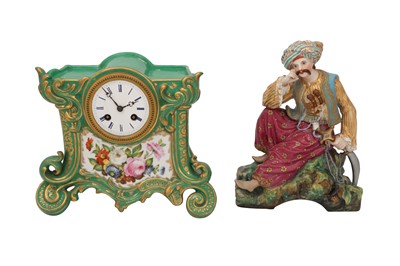 Lot 691 - AN ORIENTALIST PORCELAIN MANTEL CLOCK WITH A RESTING TURK