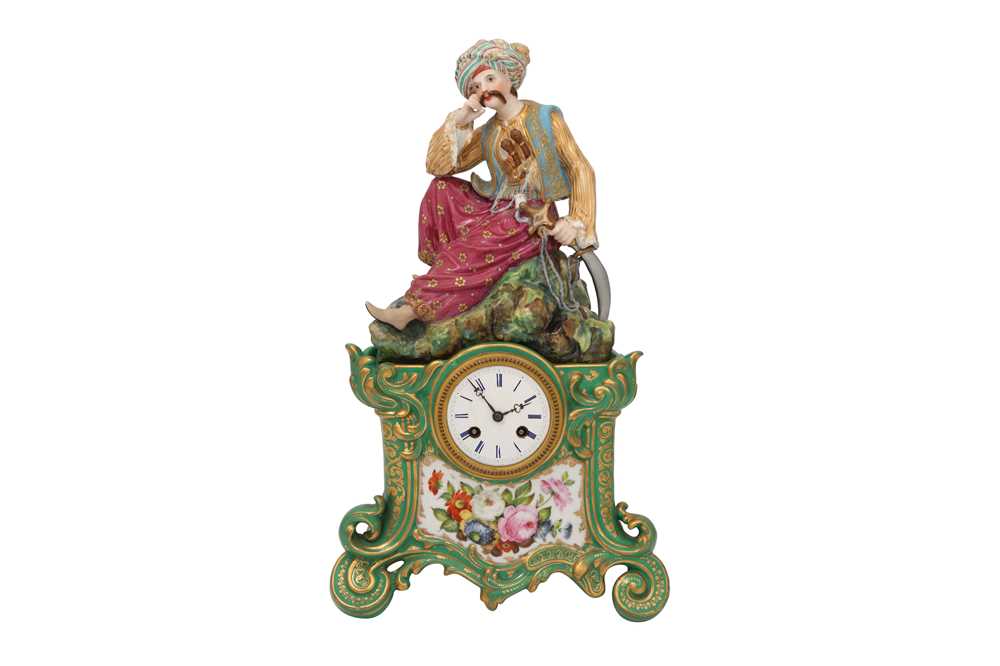 Lot 691 - AN ORIENTALIST PORCELAIN MANTEL CLOCK WITH A RESTING TURK