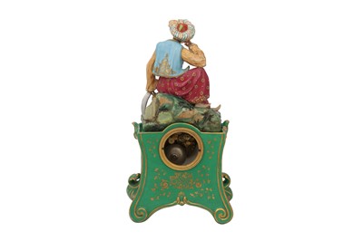 Lot 691 - AN ORIENTALIST PORCELAIN MANTEL CLOCK WITH A RESTING TURK