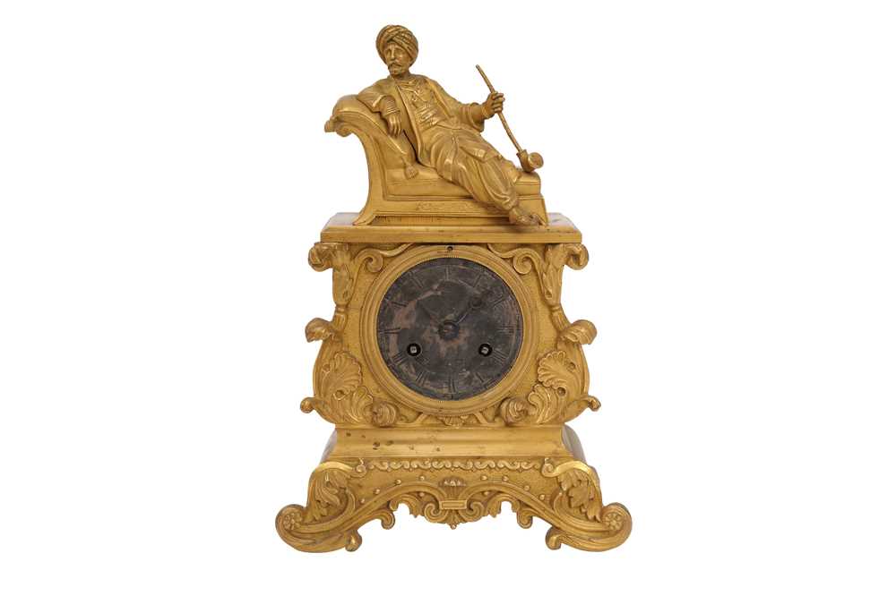 Lot 689 - AN ORIENTALIST ORMOLU MANTEL CLOCK WITH SMOKING TURK