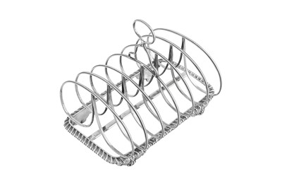 Lot 576 - A George IV sterling silver seven bar toast rack, Sheffield 1821 by Thomas and John Settle