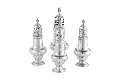 Lot 615 - A set of three George III sterling silver casters, London 1765 by John Delmester