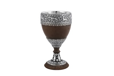 Lot 136 - A mid-19th century Anglo - Indian unmarked silver mounted coconut cup, Cutch circa 1860