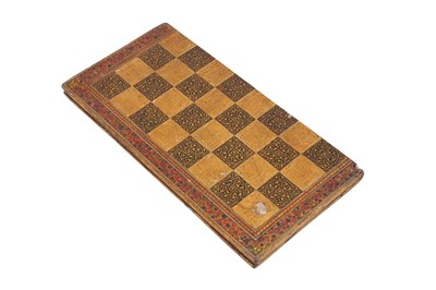 Lot 557 - A DOUBLE-SIDED LACQUERED AND GILT CHESS AND BACKGAMMON BOARD