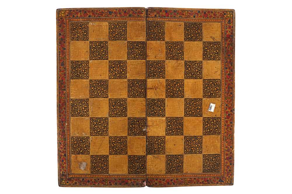 Lot 557 - A DOUBLE-SIDED LACQUERED AND GILT CHESS AND BACKGAMMON BOARD