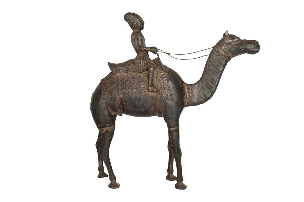 Lot 586 - AN INDIAN LOW-GRADE SILVER FIGURE OF A CAMEL AND ITS RIDER