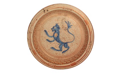 Lot 808 - A HISPANO-MORESQUE COPPER LUSTRE-PAINTED POTTERY CHARGER WITH RAMPANT LION