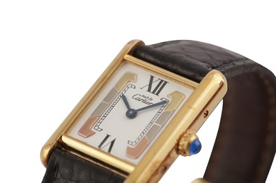 Lot 17 - A CARTIER UNISEX SILVER AND GOLD PLATED QUARTZ WRISTWATCH WITH TRINITY DIAL