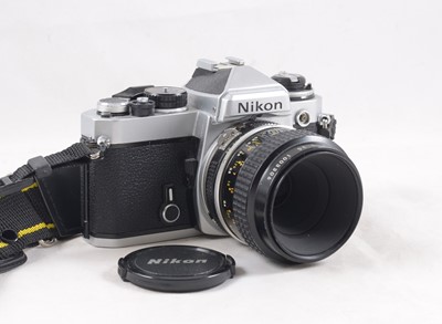 Lot 376 - Chrome Nikon FE Camera with Nikkor Micro Lens.