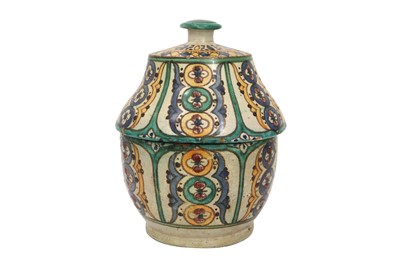 Lot 796 - A TUNISIAN CHEMLA POTTERY JAR WITH COVER