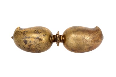 Lot 507 - A PORTABLE MANGO-SHAPED BRASS LIME PASTE CONTAINER
