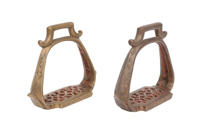 Lot 638 - A PAIR OF ENGRAVED AND ENAMELLED BRONZE STIRRUPS