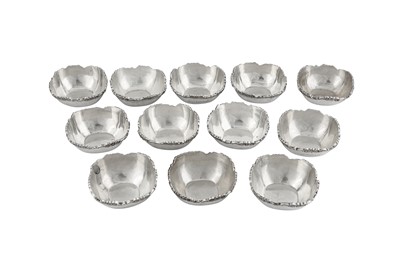 Lot 154 - A set of twelve late 20th century modern Indian silver small nut bowls