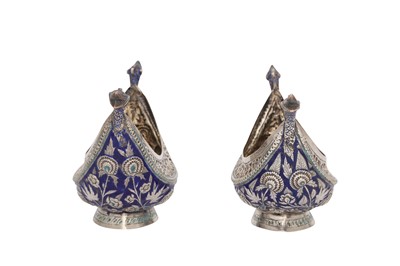 Lot 636 - A PAIR OF SILVER REPOUSSÉ AND ENAMELLED BEGGAR'S BOWLS (KASHKUL)