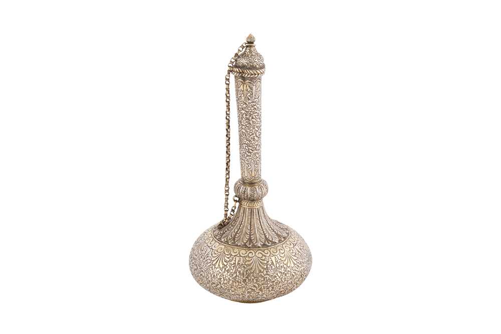 Lot 108 - A late 19th century Anglo – Indian unmarked silver parcel gilt small water bottle (surahi), Lucknow circa 1870