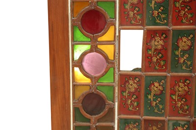 Lot 616 - A PAIR OF IRANIAN STAINED GLASS WINDOW SHUTTERS IN WOODEN FRAMES