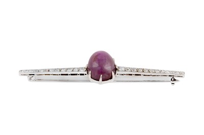 Lot 67 - A purple star sapphire and diamond brooch