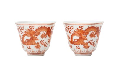 Lot 345 - A PAIR OF CHINESE COPPER-RED 'DRAGON' CUPS.