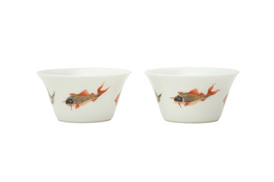 Lot 367 - A PAIR OF CHINESE FAMILLE VERTE ENAMELLED 'FISH' CUPS.
