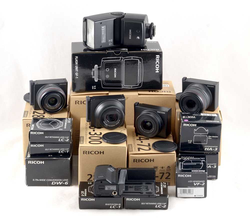 Lot 452 - Extensive 4-Lens Ricoh GXR Digital Camera Outfit.