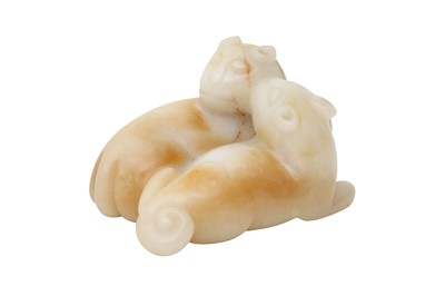 Lot 26 - A CHINESE CREAM JADE 'CATS' CARVING.