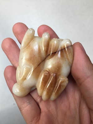 Lot 546 - A CHINESE CREAM JADE 'CATS' CARVING