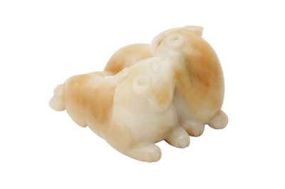 Lot 26 - A CHINESE CREAM JADE 'CATS' CARVING.