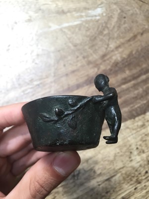 Lot 295 - A CHINESE BRONZE 'BOY' CUP.